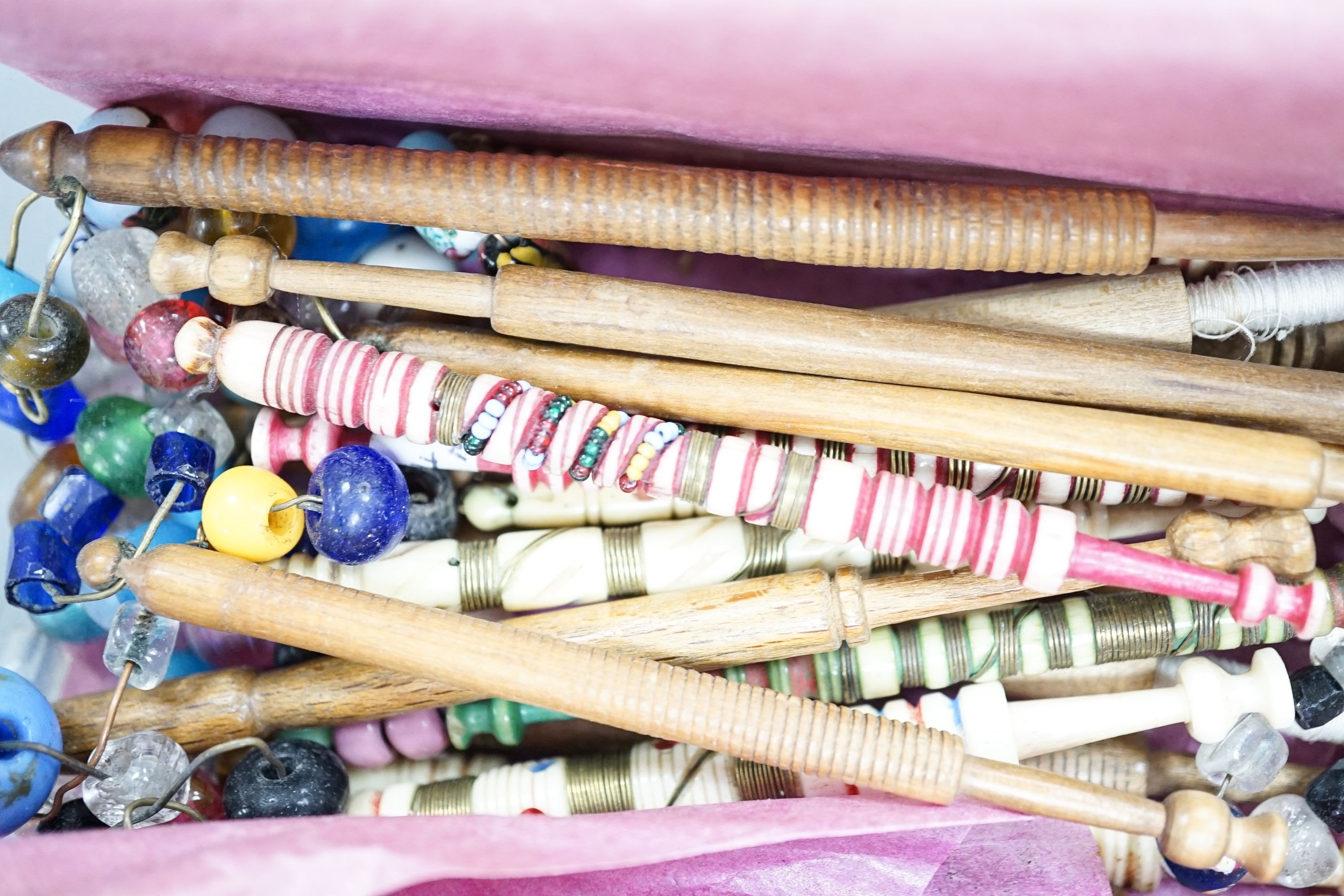 A collection of bone and wooden lace bobbins, ivory glove stretchers, boot hooks, compacts and mixed collectables